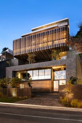 Modern residential house with dynamic wooden louver facade