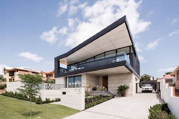 Modern two-story house with contrasting facade and cantilevered terrace