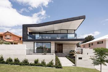 Modern facade with dynamic cantilevered roof and contrasting materials