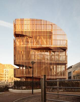 Minimalist Wooden Façade: Contemporary Architecture with Vertical Lamellae