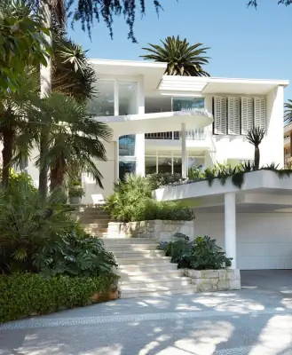 Tropical Modernism: Pristine White Villa Facade with Terraced Landscape