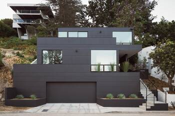 Cascading Dark Gray Facade of a Modern Hillside Home