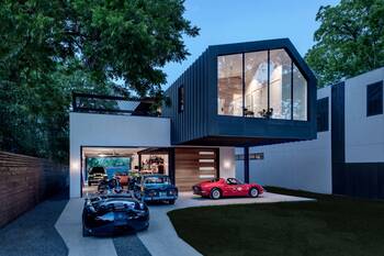 Modern facade with contrasting design: dark cantilevered volume over light base