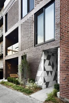 Modern Textured Brick Facade with Geometric Accents