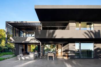 Modern minimalist facade with contrasting black and gray design and pergolas