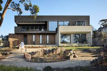Modern Contrasting Facade with Wood, Concrete, and Metal Combination