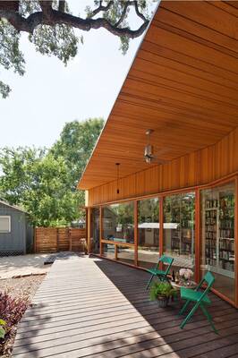 Modern wooden facade with panoramic glazing and functional deck
