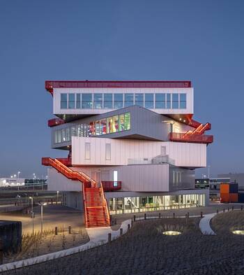 Stylish deconstructivist facade with red accents and offset volumes