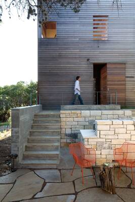 Modern wooden facade with horizontal cladding and contrasting stonework