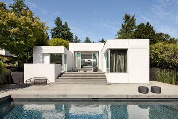 Snow-white minimalist facade with panoramic glazing