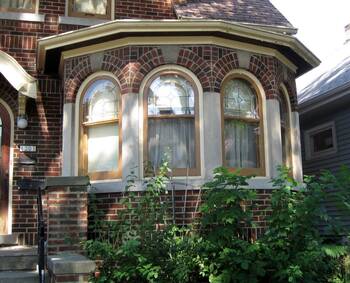 Classic Brick Facade with Bay Window in Tudor Style