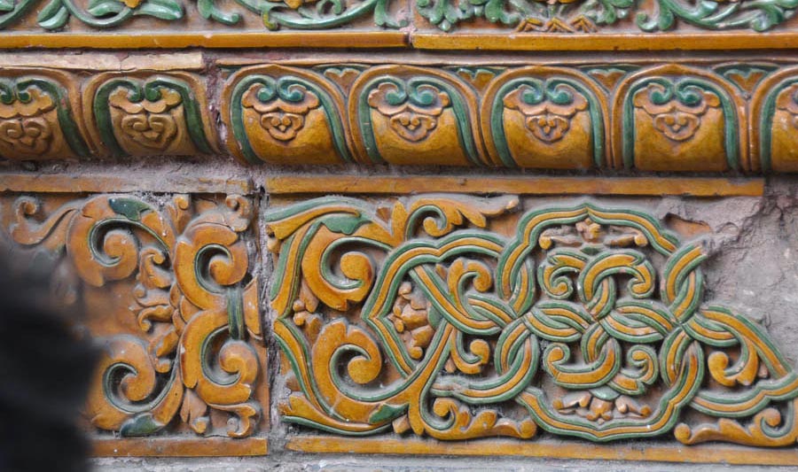 Fragment of glazed facade decor