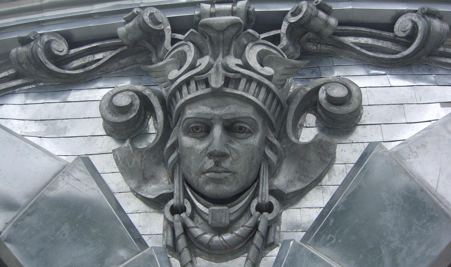 Metal mask on the facade