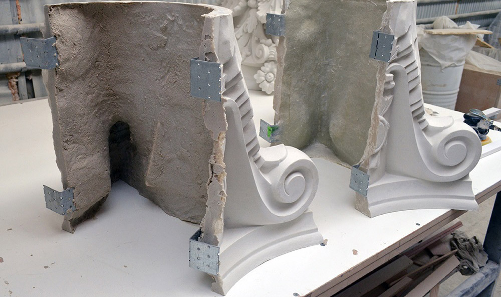 Fragments of the Corinthian capitol in polymer concrete with a smooth matte finish
