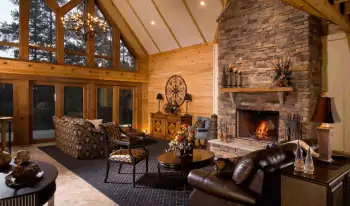 Mountain lodge with stone fireplace: harmony of wood and stone in a spacious interior