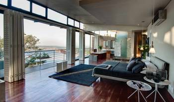 Modern Studio Bedroom with Panoramic View: Integrating Nature into Minimalist Interior