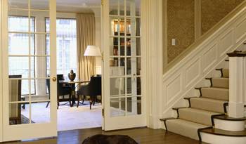 Classic Elegance: French Doors and Panel Details in Country House Interior