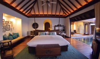 Tropical Elegance: Villa Interior with Open Layout and Wooden Beam Ceiling
