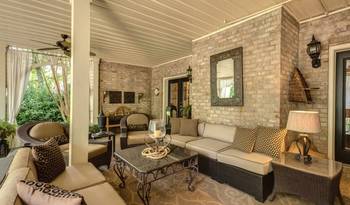Elegant Brick-Walled Veranda: A Fusion of Comfort and Sophistication