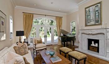 Classical Elegance: Living Room Interior with Arched Elements and Marble Fireplace