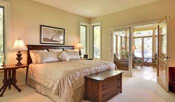 Elegant Bedroom with French Doors: Harmony of Classic and Modern in a Country House