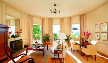 Elegant living room with panoramic windows: classic style in modern interpretation