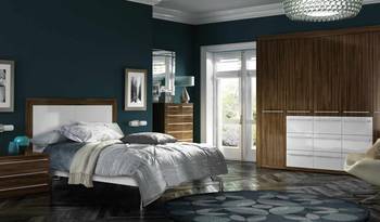 Elegant bedroom with contrasting dark teal walls and warm wood accents