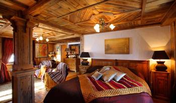 Interior design of bedroom in cottage in ethnic style.