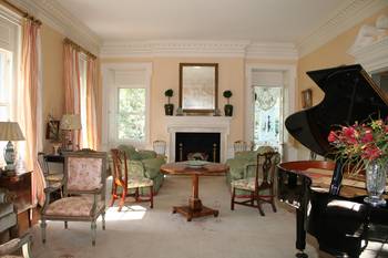 Classical Elegance: Country House Living Room with Fireplace and Grand Piano