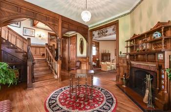 Majestic Victorian Interior: Harmony of Wood and Classical Details