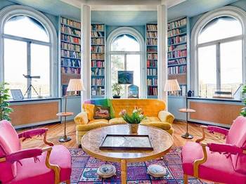 Library interior in private house in fusion style.