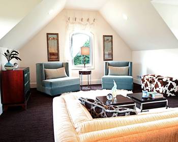 Interior design of attic in country house in fusion style.