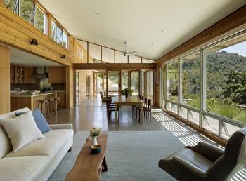 Modern interior with panoramic glazing: harmony of wood and light in a country house