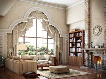Classic Mediterranean-style living room with arched window and stone fireplace