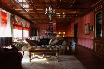 Luxurious classical interior with coffered ceiling and red walls