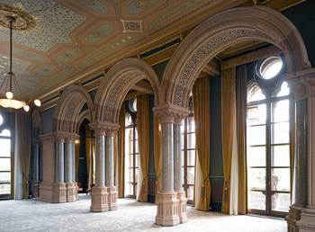 Majestic Neoclassicism: Architectural Rhythm of Arches and Decorative Ceiling Richness