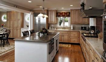 Elegant Kitchen with Traditional Elements: Harmony of Wood and Stone in Country House Interior