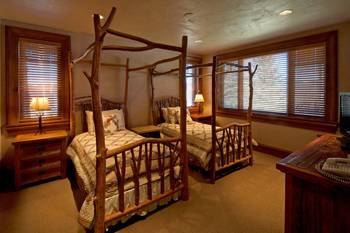 Rustic Harmony: Bedroom with Raw Wood Four-Poster Beds in a Country House
