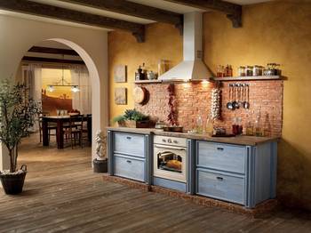 Tuscan Idyll: Cozy Mediterranean-Style Kitchen with Brick Masonry and Wooden Beams