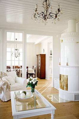 Scandinavian Elegance: Bright Interior with a Tiled Stove