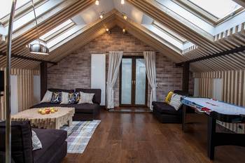 Design of attic in private house in ethnic style.