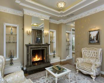 Luxurious Neoclassical Living Room with Marble Fireplace and Golden Accents