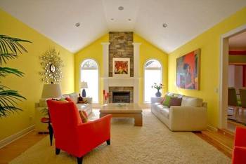 Sunny living room with contrasting accents and stone fireplace