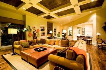 Luxurious living room with coffered ceiling: warm palette and thoughtful functionality