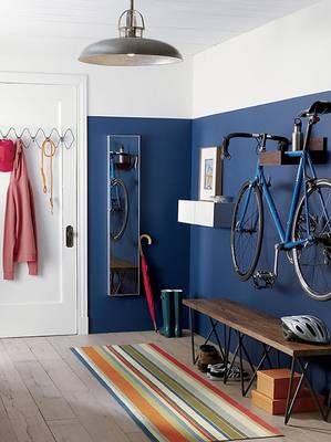 Functional Entryway with Blue Walls: Bicycle as a Decorative Element