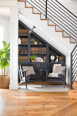 Modern under-stair library: efficient space utilization in a country house