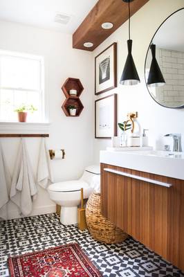 Modern bathroom with warm wooden accents and graphic geometry