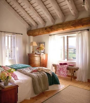 Rustic Elegance: Bedroom with Exposed Beams and Natural Light