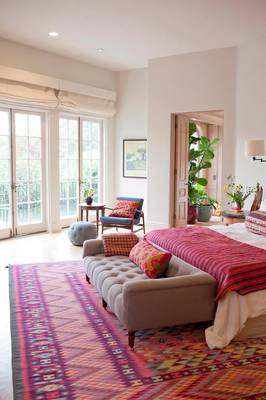 Elegant Bedroom with Ethnic Accents: Harmony of Light and Color in a Country House