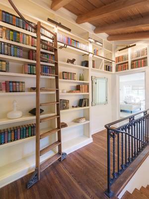 Beautiful design of library in private house in artistic style.
